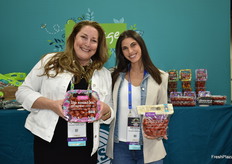 Helen Aquino and Krysten DeGiglio with Village Farms show lip smackn' grapes and heavenly villagio marzano tomatoes. 