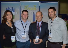 Also exhibiting is sister company D'Arrigo Bros. of New York. From left to right: Gabriela D'Arrigo, Brian D'Arrigo, Matthew D'Ariggo and Kevin D'Arrigo. Matthew proudly shows the Chandler Copps award he received at the NY Produce Show.