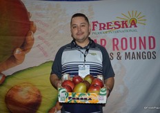 Jose Juan Rodriguez with Freska Produce. Jose shows mangos from Ecuador. Peruvian mangos will arrive in two weeks.