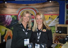 Patty Rodriguez and Katiana Valdes with Crystal Valley Foods. Katiana shows blueberries and blackberries that are available now.