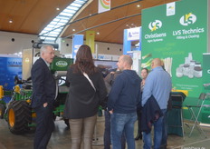 Hans Kalter (1st from left) and Managing Director Angelique Christiaens (r) of Christiaens Agro Systems talking to some interested parties.