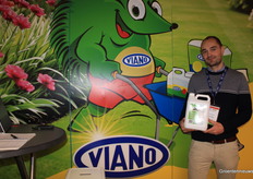 Viano's Pieter Krauch holds a container of biostimulant especially for soft fruit.