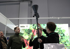 Just demonstrating an innovation at Biobest. These visitors are having fun with the technique on biological control agents to put out.