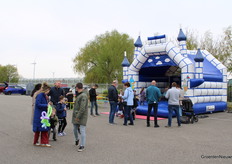 Balloons and a bouncy castle, the kids are having a great time!