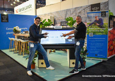 Steven Madern and Hans Belt of 30MHZ at the mega screen displaying the company's solutions.