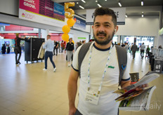 Christos Raftogiannis with CityCrop is picking up a Greenhouse Guide.