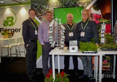 Berger's exhibition team pictured with ferns, cyclamen and celosias.