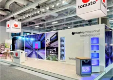 The Tomato+ booth showcasing their newest HortoProfessional, a container farm 