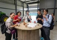 Mio Ariga & Mio Tanaka, Delphy, have some strawberries with visitors of the tour