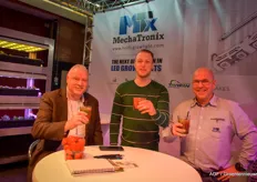 Thursday 4 PM means show organiser Willem van Eldik (left) with Delphy can also relax for a while. Is there a better way to do that than with a cocktail under the cosy LED lights at MechaTronix? On the photo with his son Chris van Eldik who's working with Groda and Koen Vangorp with Mechatronix.