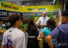 Jonathain Krouss with Floragard talks to visitors about their different peat products and how to select the best one for your crop