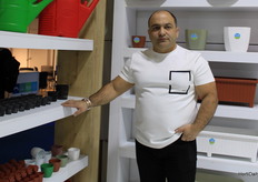 Mustafa Aici with Spring, showing a wide range of plastic pots and cultivation trays