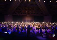 Audience flashlights shine as the conference sets out to light the way for growers nationwide.