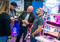 Camille Michaud, Dubois Agrinovation, in conversation with a visitor