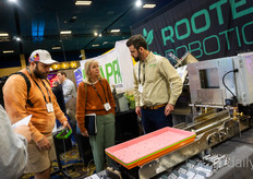 Eric Roth, Rooted Robotics, talks to visitors about his automation solutions