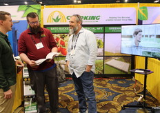 Lehren Olk-Szost with the Northern Michigan Univertity talking to the guys of Cropking, Nathan Donley and Paul Brentlinger