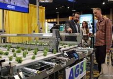 Chris Hawk, Lubing USA, talking to a visitor and explaining the automated Gutter System