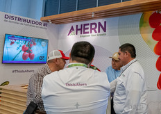 Meetings at Ahern's booth.

