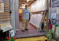 Kurt Keil from Advancing Alternatives with the Posi Clasp mobile roll-up curtain systems booth.