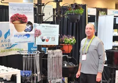 Karl Eckert of Eckert Greenhouse promoting his innovative hanging baskets with water reservoirs.