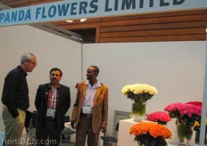 Paul Wanderi and Joram Kanyua from Panda Flowers Limited talking with a visitor.