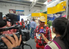 A local Mexican TV station interviewing visitors of the show.