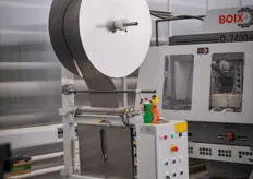 In order to protect the tomatoes for a bumpy ride, each box is prepared with a piece of foam that comes from this roll. It is automatically being cut by a machine.