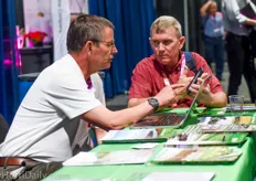 Dennis Raath of greenhouse manufacturer Rough Brothers Inc welcoming a visitor at his booth.