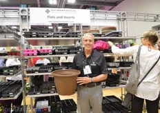 Timothy S. Allen of East Jordan plastics holding their new 14 inch planter.