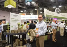 Bryce Anderson of The HC Companies holding their new biodegradable pots. They are made from recycled newspaper. In order to market the product, they use a 3 way approach; towards the grower, retailer and end consumer.
