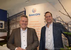 Arjan van der Meer & Olaf Mos, Gakon, standing in front of the new logo