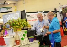 Rick Bradt of A.M.A welcomes a grower at their booth.