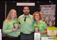 Shelbi Kautz, Rudy Placencia and Tristan Simpson with Nichols Farms show the company's Nic's Mix, a combination of pistachios and almonds.