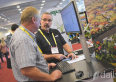 Eric Schmidt with Argus Control Systems explaining the companies products & benefits to a visitor