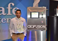 Sannel Patel with the BioSafe Systems Oxyfusion machine