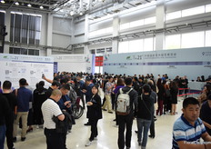 Visitors getting their badges. Not only the old fashion way, also via We Chat.