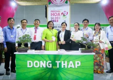 Opening of the Dong Thap Province pavilion. Dong Thap province is known for its flower production and fruit,  including mango, chiles, orange and longan. In addition, it has large lotus production. On the photo is Mai, second from right. Mr Le Quoc Dien is the Director of the department of agriculture and rural development of Dong Thap, fourth from the left. 