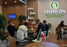 Gokhan Gosterisli talking business in his booth Greencon