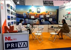 Sales representatives from Priva are at the booth.