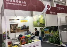 The sales representative of Floragard, a German company is talking with the visitor. German Floragard is a supplier of cultivation substrates.